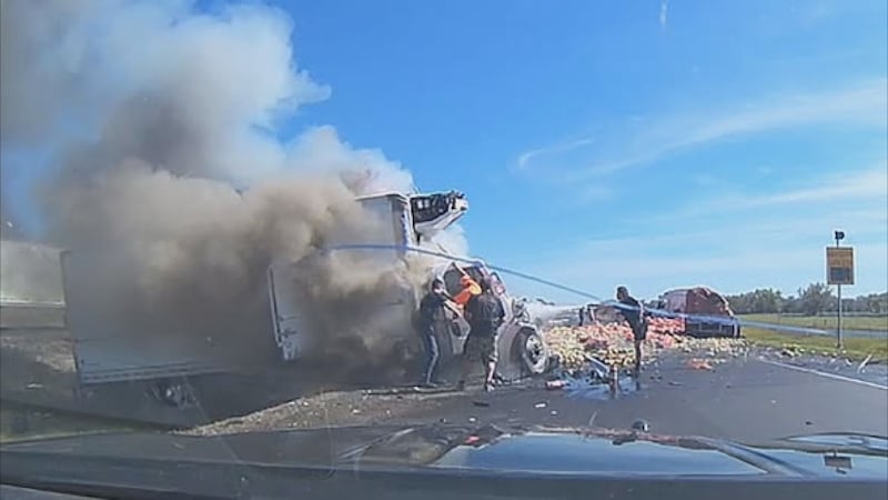A Nebraska state trooper, two state transportation workers and bystanders rescued a trapped...