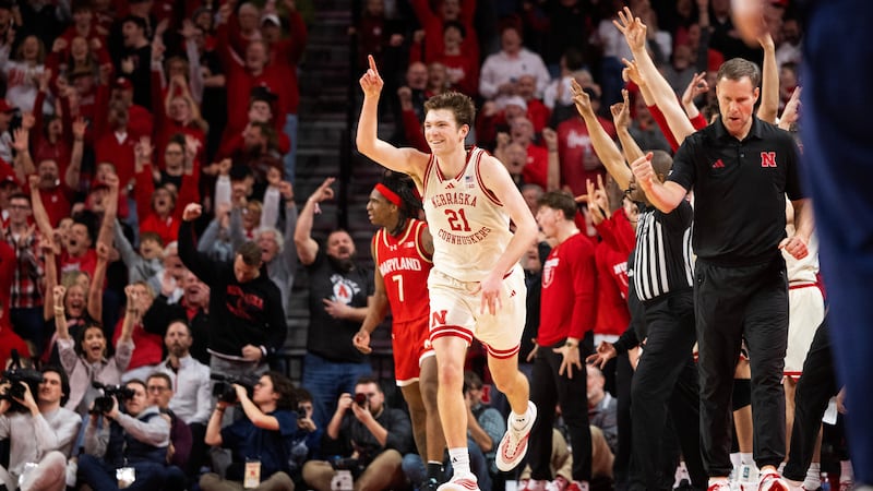 Nebraska's Pryce Sandfort (21) celebrates after making a three point shot against Maryland...