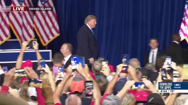 President Donald Trump arrives on the stage at the Nebraska State Fairgrounds’ Pinnacle Bank...